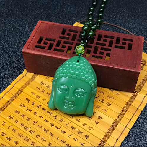 Green carved stone buddha head - stone,